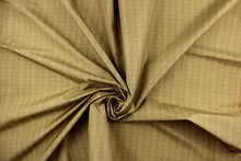 Load image into Gallery viewer, This stunning yarn dyed fabric features a small plaid design in beige and brown tones .
