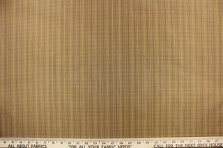 This stunning yarn dyed fabric features a small plaid design in brown and beige.