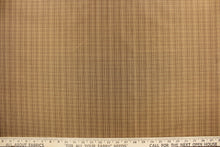 Load image into Gallery viewer, This stunning yarn dyed fabric features a small plaid design in tan, brown and burgundy . 
