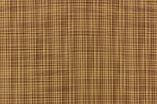 This stunning yarn dyed fabric features a small plaid design in tan, brown and burgundy . 