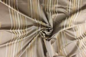  This rich woven yarn dyed fabric features narrow width cream and khaki stripes on taupe background. 
