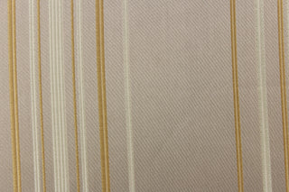  This rich woven yarn dyed fabric features narrow width cream and khaki stripes on taupe background. 